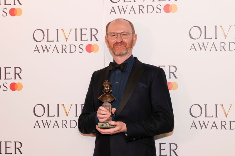Mark Gatiss, winner of the best actor award for "The Motive and The Cue", poses for photographers in the winner's room during the Olivier Awards on Sunday, April 14, 2024, in London. (Photo by Vianney Le Caer/Invision/AP)