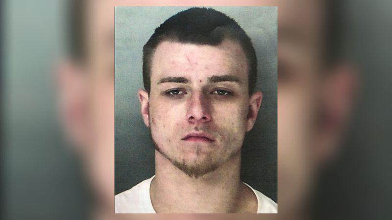 Deputies said Austin Strickland was hiding in a safe filled with drug paraphernalia and weapons when  they arrested him. 