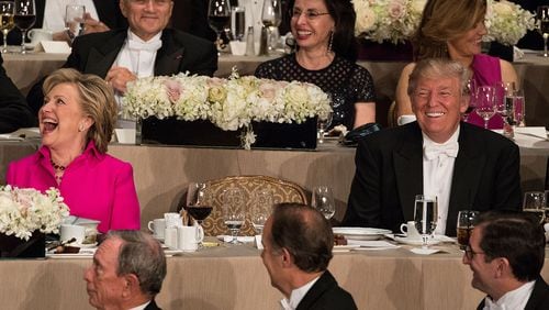 Hillary Clinton and Donald Trump laugh after speaking at the Alfred E. Smith Memorial Foundation dinner at the Waldorf Astoria hotel in New York, Oct. 20, 2016. Following Donald Trump at the annual Catholic charity dinner, Clinton began with a traditional self-deprecating joke before turning cutting. ?It?s amazing I?m up here after Donald,? she said. ?I didn?t think he?d be OK with a peaceful transition of power.? (Damon Winter/The New York Times)