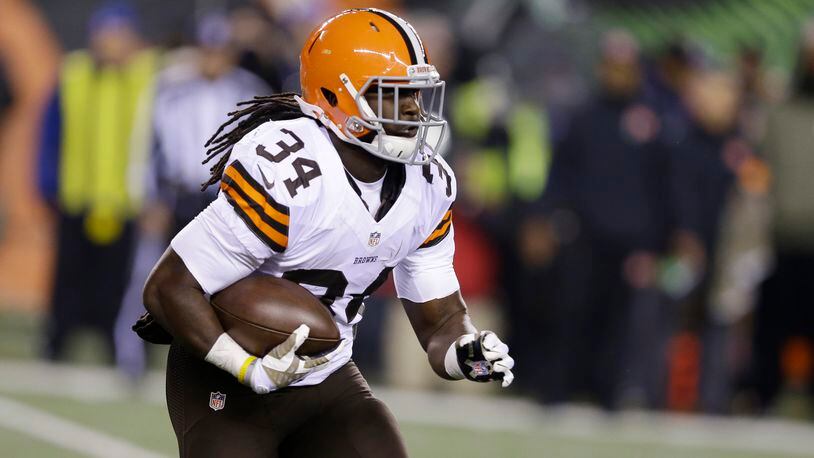 Cleveland Browns running back Isaiah Crowell (34) runs the ball during the first half of an NFL football game against the Cincinnati Bengals Thursday, Nov. 6, 2014, in Cincinnati. (AP Photo/Michael Conroy)