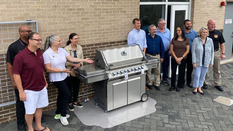 Recently 11 local Sandy Springs neighborhoods joined forces to donate a new grill to the fire station. (Courtesy City of Sandy Springs)