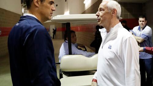 Villanova head coach Jay Wright, left, and North Carolina head coach Roy Williams talk after a CBS Sports Network interview for the NCAA Final Four tournament college basketball championship game Sunday, April 3, 2016, in Houston. Villanova and North Carolina will play in the championship game on Monday. (AP Photo/David J. Phillip)