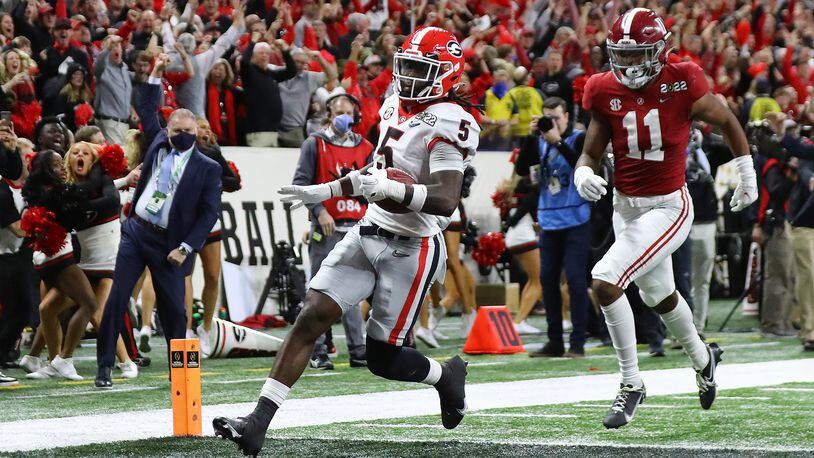 Georgia defensive back Kelee Ringo intercepts Alabama and returns it for a touchdown for a 33-18 lead and victory over Alabama in the College Football Playoff Championship game on Monday, Jan. 10, 2022, in Indianapolis. (Curtis Compton/The Atlanta Journal-Constitution/TNS)
