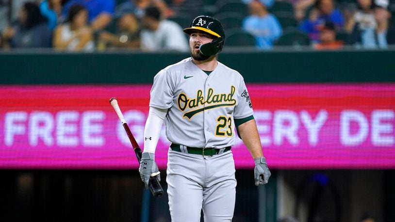 The Athletics' Shea Langeliers, a former Braves prospect, walks back to the dugout after striking out during the seventh inning Tuesday night against the Rangers in Arlington, Texas. (AP Photo/Tony Gutierrez)