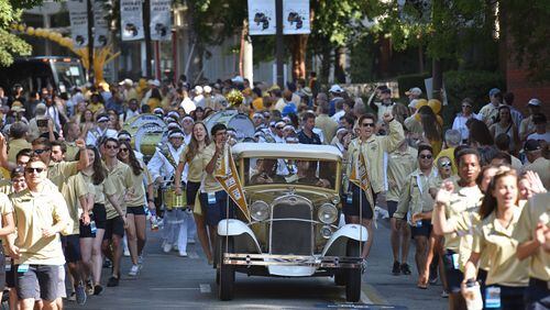 Georgia Tech's Ramblin' Wreck leads the band, cheerleaders, players and coaches during the Players' Walk before the home opener against the Jacksonville State in September. HYOSUB SHIN / HSHIN@AJC.COM