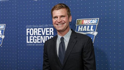 Clint Bowyer poses for photographers on the red carpet before the NASCAR Hall of Fame Induction ceremony in Charlotte, N.C., Friday, Jan. 20, 2017. (AP Photo/Mike McCarn)
