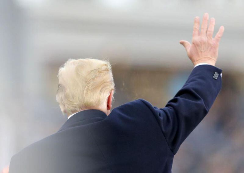 President Donald Trump waves as he takes his seat before the game between the Army Black Knights and the Navy Midshipmen at Lincoln Financial Field on December 08, 2018 in Philadelphia, Pennsylvania. Trump is on the shortlist for Time's Person of the Year magazine cover.