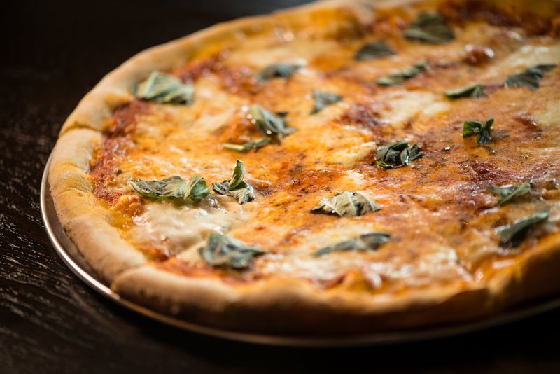 New Realm Brewing wood-fired Margherita Pizza with San Marzano Tomato, Mozzarella, Torn Basil. Photo credit- Mia Yakel.