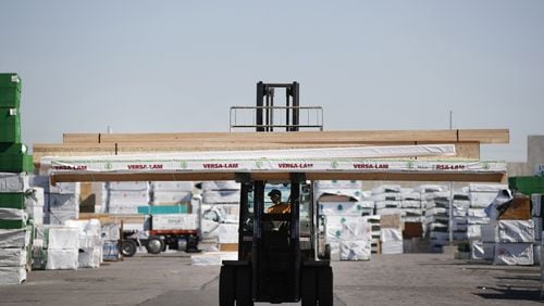 After a year that saw record-high lumber prices and shortages nationwide, the price for lumber finally began to drop last week. (Bloomberg photo by George Frey)