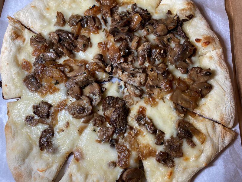 Iron Hill's Garcia pizza comes with roasted mushrooms, garlic oil, caramelized onions, mozzarella and pecorino Romano cheese. Bob Townsend for The Atlanta Journal-Constitution 