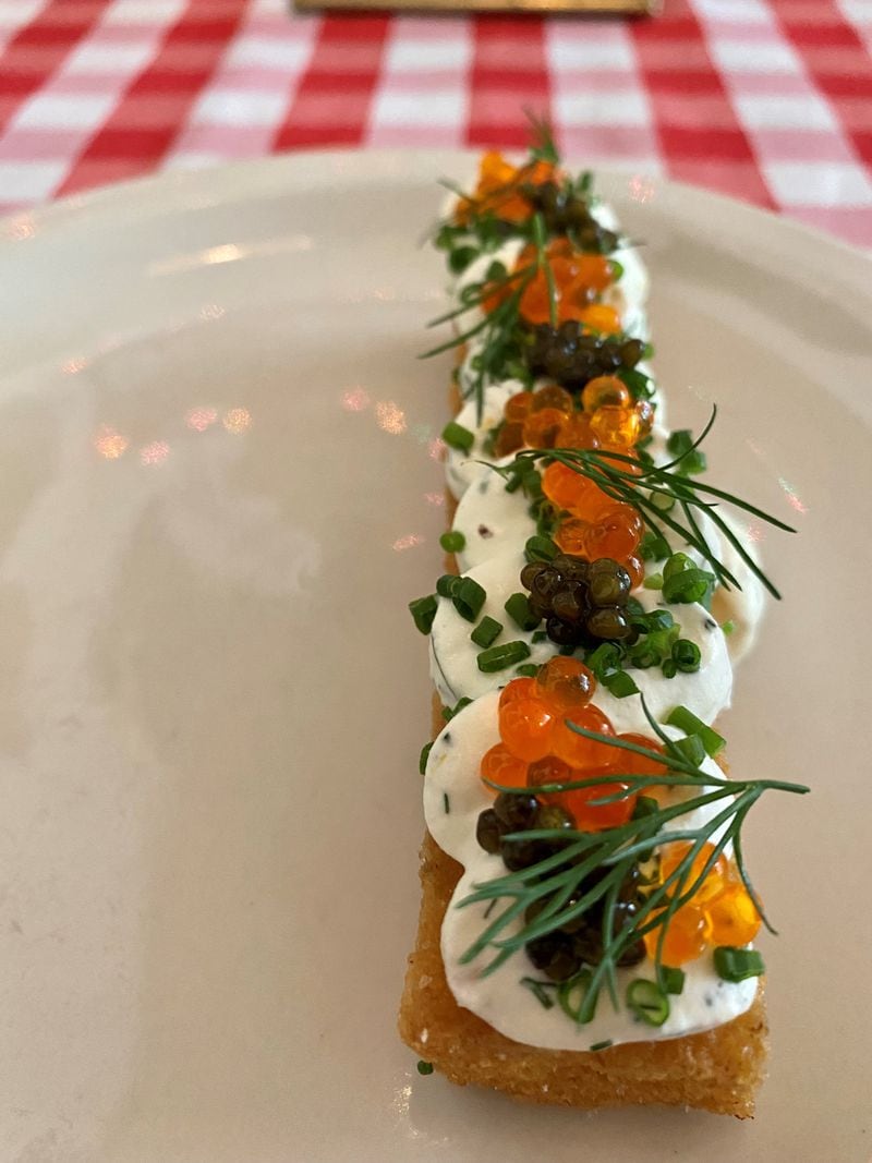 A signature dish at Gigi’s is the fried polenta, crowned with sturgeon caviar, trout roe, creme fraiche, dill and chive. Wendell Brock for The Atlanta Journal-Constitution