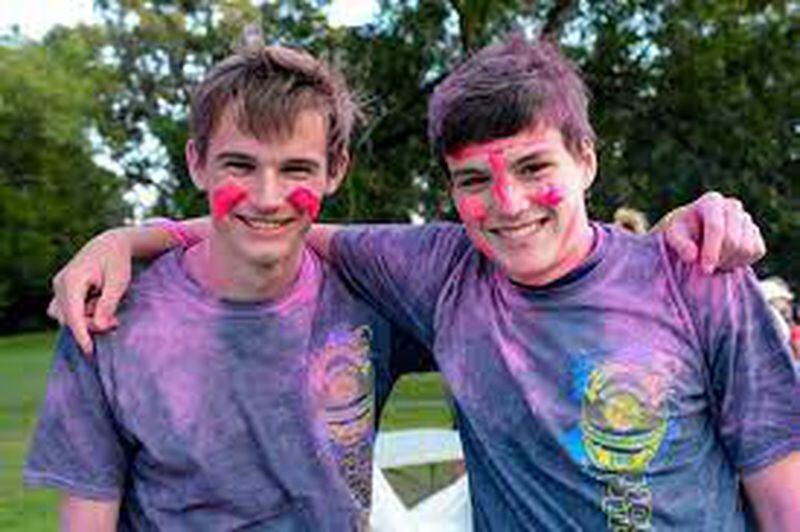 Paint yourself to prepare for blacklight areas at the Hot Pursuit Glow Run in Murphey Candler Park.