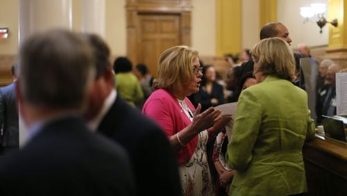 Republican Sen. Renee S. Unterman (left) confers with House Speaker Pro-Tempore Jan Jones late in the night Thursday, March 24 — the 40th and final day of the Georgia 2016 legislative session.  Rape kit legislation that was passed in the House but blocked by Unterman went on to clear its final hurdle.  BOB ANDRES / BANDRES@AJC.COM