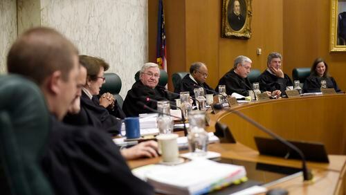 In this January file photo, all nine justices meet at the Georgia Supreme Court for oral arguments in Atlanta. DAVID BARNES / DAVID.BARNES@AJC.COM)