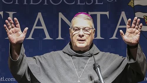 Archbishop Gregory John Hartmayer extends a Franciscan blessing to all in attendance at the end of his March 5 press conference. Pope Francis named Hartmayer the seventh archbishop for the Archdiocese of Atlanta. CONTRIBUTED BY MICHAEL ALEXANDER