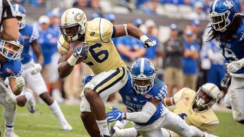 Georgia Tech running back Dedrick Mills (26) is tackled by Kentucky safety Mike Edwards (27) during the TaxSlayer Bowl in Jacksonville, Fla., on Dec. 31, 2016. (AP Photo/Stephen B. Morton, File)