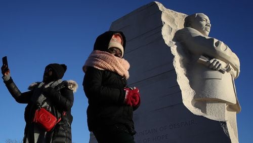 WASHINGTON, DC - JANUARY 15:  Saoudatou Dia (L) and her daughter Aminah (R) visit the Martin Luther King Jr. Memorial on Martin Luther King Day January 15, 2018 in Washington DC. Martin Luther King Jr. would have been 88 years old today.
 (Photo by Win McNamee/Getty Images)