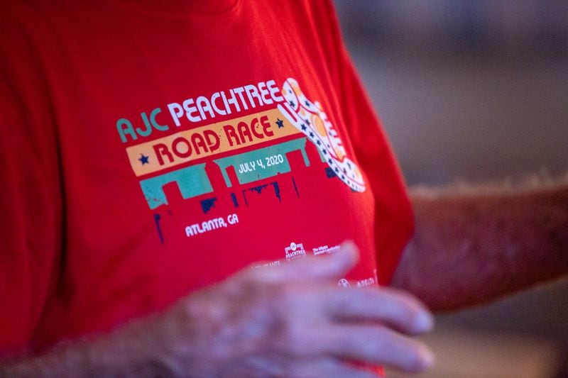 Bill Thorn is given the Peachtree Road Race t-shirt in Tyrone, Georgia, on Tuesday, October 13, 2020. Bill Thorn was presented the t-shirt for the annual Peachtree Road Race on Tuesday by the Atlanta Track Club. (Photo/Rebecca Wright for the Atlanta Journal-Constitution)