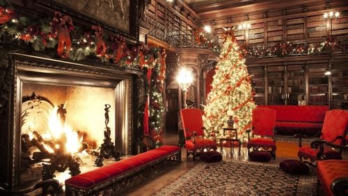 The Biltmore House library gets all decked out at Christmas time. The entire Biltmore Estate will show off some 70 hand-decorated Christmas trees during the holiday season.