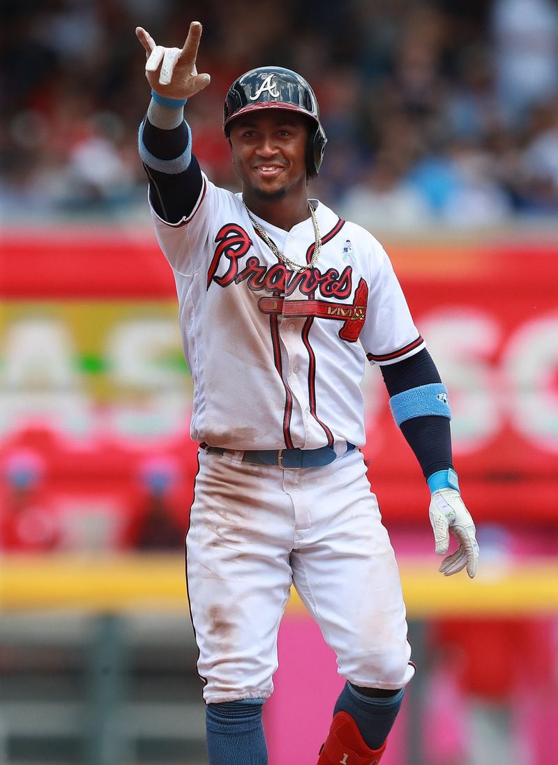 Atlanta Braves Ozzie Albies reacts to the fans after hitting a 2-RBI double to take a 9-1 lead over the Philadelphia Phillies during the fifth inning in a MLB baseball game on June 16 in Atlanta. Curtis Compton/ccompton@ajc.com