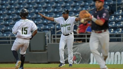 Gwinnett Stripers’ Danny Santana (15) is called safe at first allowing for a run to score in their game against the Louisville Bats in a minor league baseball game at Coolray Field on Monday, August 13, 2018, in Lawrenceville. JENNA EASON / JENNA.EASON@COXINC.COM