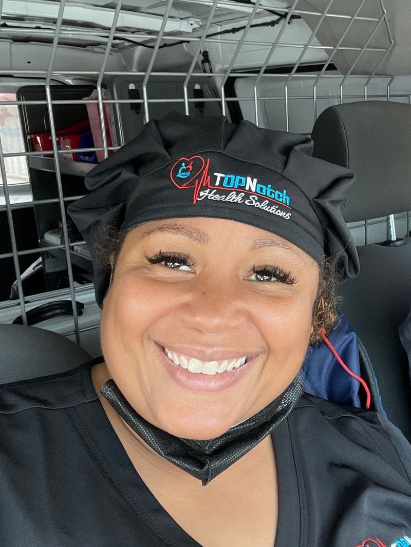 Top Notch Health Solutions’ Paula Richardson pictured in her mobile testing van with a fellow staffer, Quanteria Morton Jr. (Courtesy of Paula Richardson)