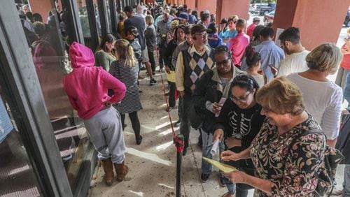 Long lines form at an early-voting site in Cobb County. JOHN SPINK/JSPINK@AJC.COM