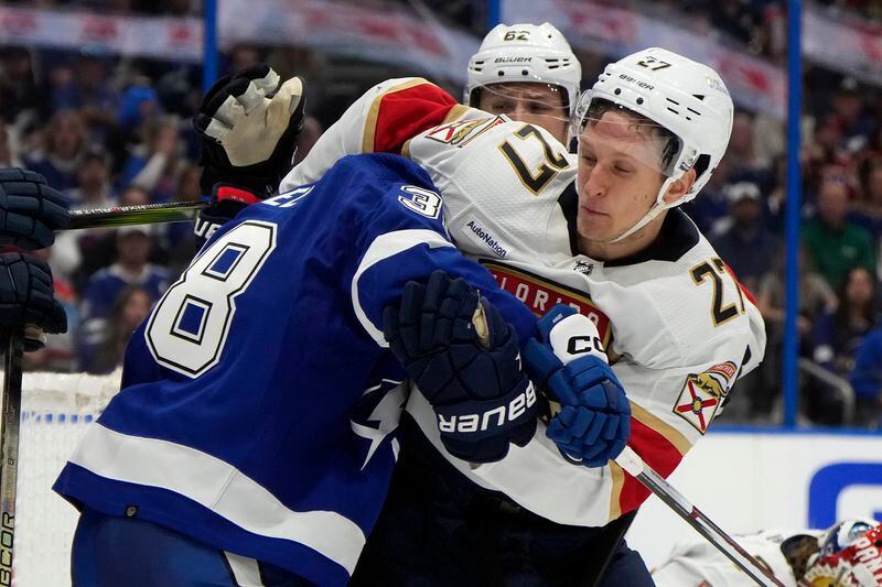 Florida Panthers center Eetu Luostarinen (27) and Tampa Bay Lightning left wing Brandon Hagel (38) scrap during the second period in Game 3 of an NHL hockey Stanley Cup first-round playoff series, Thursday, April 25, 2024, in Tampa, Fla. (AP Photo/Chris O'Meara)