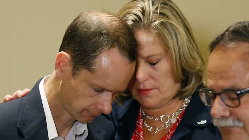 An emotional Matthew and Jill McCluskey embrace following a June 27, 2019, news conference in Salt Lake City. The couple is suing the University of Utah in connection with the on-campus murder of their daughter, Lauren McCluskey, on Oct. 22, 2018.