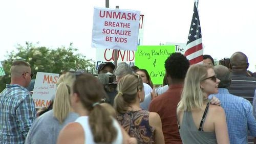 Parents protest the mask mandate in Gwinnett County Public Schools at the J. Alvin Wilbanks Instructional Support Center in Suwanee on July 30, 2021. (Rebecca Wright for The Atlanta Journal-Constitution)