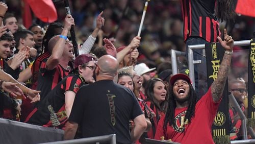 Rapper Waka Flocka Flame cheers with Atlanta United fans in the second half during the Eastern Conference Final soccer match at Mercedes-Benz Stadium on Wednesday, October 30, 2019. Toronto FC won 2-1 over the Atlanta United. (Hyosub Shin / Hyosub.Shin@ajc.com)