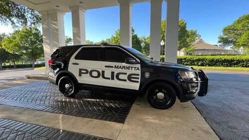 Maj. Patrick Bonito was temporarily suspended after authorities with Marietta police learned he used a racial term about 10 years ago, the chief said.