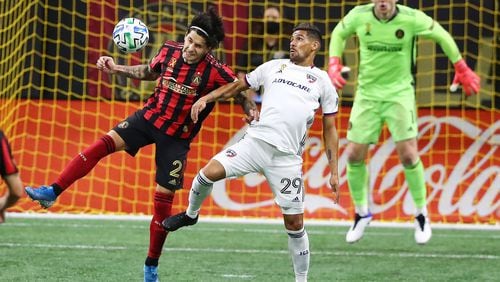 Atlanta United defender Franco Escobar, left, takes the ball away from FC Dallas forward Franco Jara in front of the goal, with goalkeeper Brad Guzan looking on during the second half on Wednesday, Sept. 23, 2020, at Mercedes-Benz Stadium in Atlanta. Atlanta United won, 1-0. (Curtis Compton/Atlanta Journal-Constitution/TNS)
