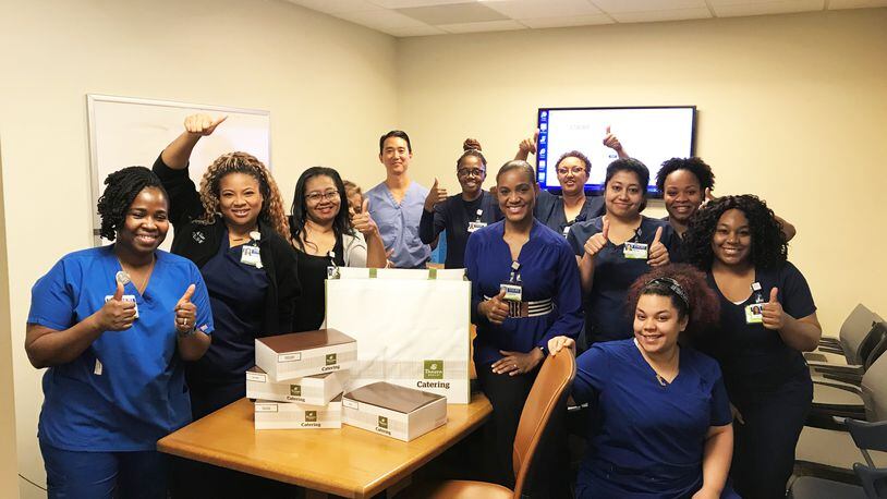 Hospital workers at Emory receive a delivery donated through the Meal Bridge.  COURTESY OF THE MEAL BRIDGE