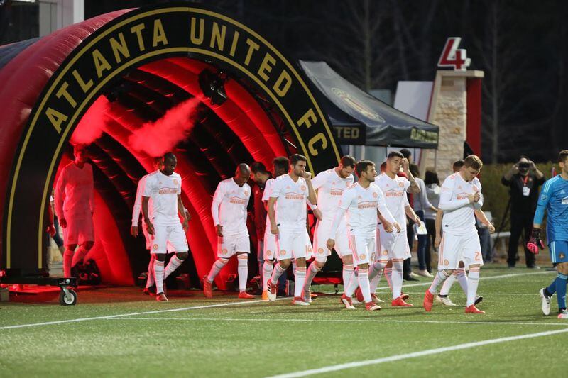 Atlanta United players enter the pitch wearing the "King Peach" alternate kits.