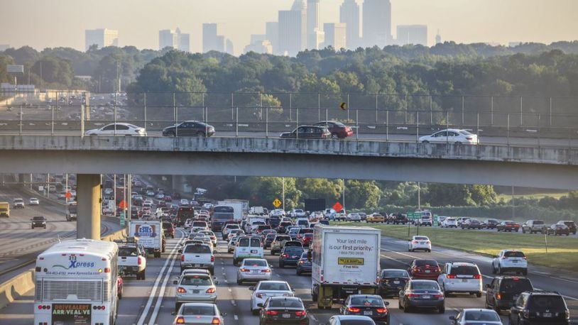 The Atlanta skyline loomed overhead as northbound traffic crawls along the connecter past Arthur B. Langford Parkway. Southside commuters riding into Atlanta experienced unusual long delays on Thursday, Aug. 25, 2016 starting with a crash at 5:59 a.m. that took up 3-center northbound lanes that caused heavy delays on I-75 at I-285 in Clayton County. The crash kept cars at a crawl from Jonesboro Rd./Hwy 54 according to the WSB 24-hour Traffic Center. Following that crash just before 7 a.m. a rollover crash on the I-75 / I-85 connector between Fair Drive and University Avenue further exacerbated traffic flow. Officials offered no additional details concerning the crashes. JOHN SPINK /JSPINK@AJC.COM