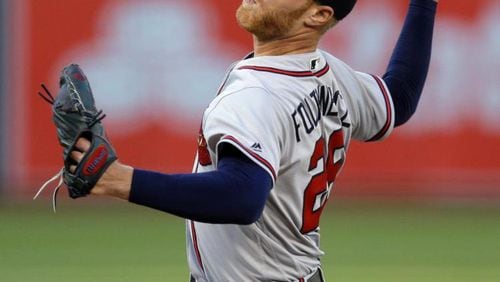 When Mike Foltynewicz took a no-hitter to the ninth inning Friday at Oakland, he and his Braves teammates were wearing red-billed caps instead of the all-navy variety the Braves have worn on the road since 2009. (AP photo)
