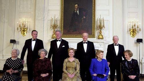 President Clinton, standing, second from left, and first lady Hillary Rodham Clinton, seated, center, pose with Lady Bird Johnson, seated 2nd from left, President Carter and his wife Rosalynn, far right, President Ford and wife Betty, second from right, President Bush and wife Barbara far left, during a dinner in honor of the 200th anniversary of the White House Thursday, Nov. 9, 2000 in Washington. As the nation awaited word on its next chief executive, the three former presidents joined President Clinton at the White House on Thursday night to celebrate the mansion's two centuries as a symbol of leadership and continuity. (AP Photo/Kenneth Lambert)