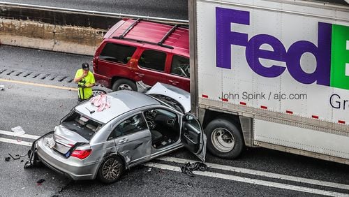 A FedEx box truck and at least two passenger vehicles were involved in one of the wrecks.