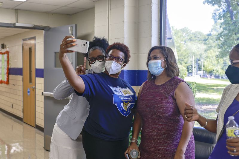 DeKalb Schools interim Superintendent Vasanne Tinsley (right) takes a selfie with Wadsworth Magnet School Principal Ledra Jemison (left) and PTA co-president Gayle Murray at open house on Wednesday, August 3, 2022. (Natrice Miller/natrice.miller@ajc.com)