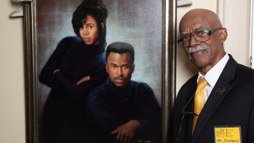 Portrait of Tom Dorsey with a painting he did of his children Scott & Carol in his Atlanta home. He made a name for himself with his photographs of well-known African American families, but his focus is now on young black teen males who don’t have good family role models. The 82-year-old has been mentoring teens since 2007, and is still at it, constantly working out his program and asking other men to come help. (Photo by Phil Skinner)