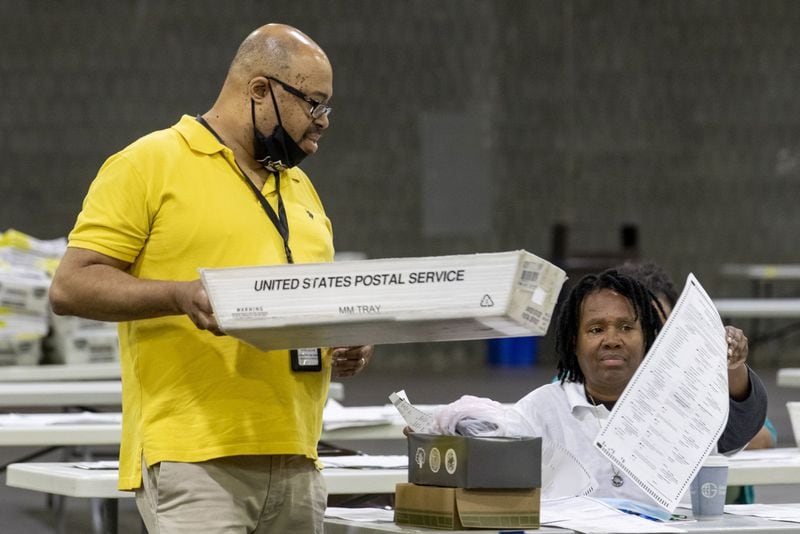 06/10/2020 - Atlanta, Georgia - Fulton County employees continue to count mail-in ballots the day after the Georgia primary election at the Georgia World Congress Center in Atlanta, Wednesday, June 10, 2020. A spokesperson for Fulton County said that they will announce the final number of mail-in ballots on Wednesday. (ALYSSA POINTER / ALYSSA.POINTER@AJC.COM)