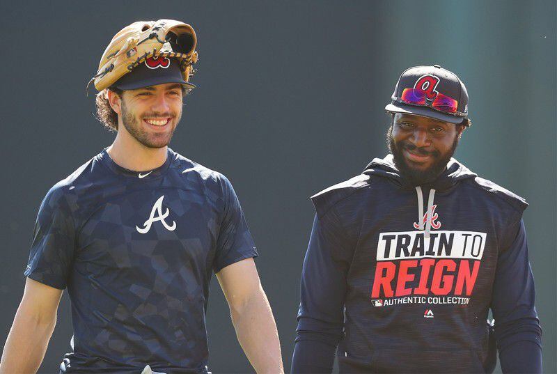  Braves rookie shortstop Dansby Swanson and veteran second-base newcomer Brandon Phillips looked like old friends by the end of Day 1 together. (Curtis Compton/AJC)