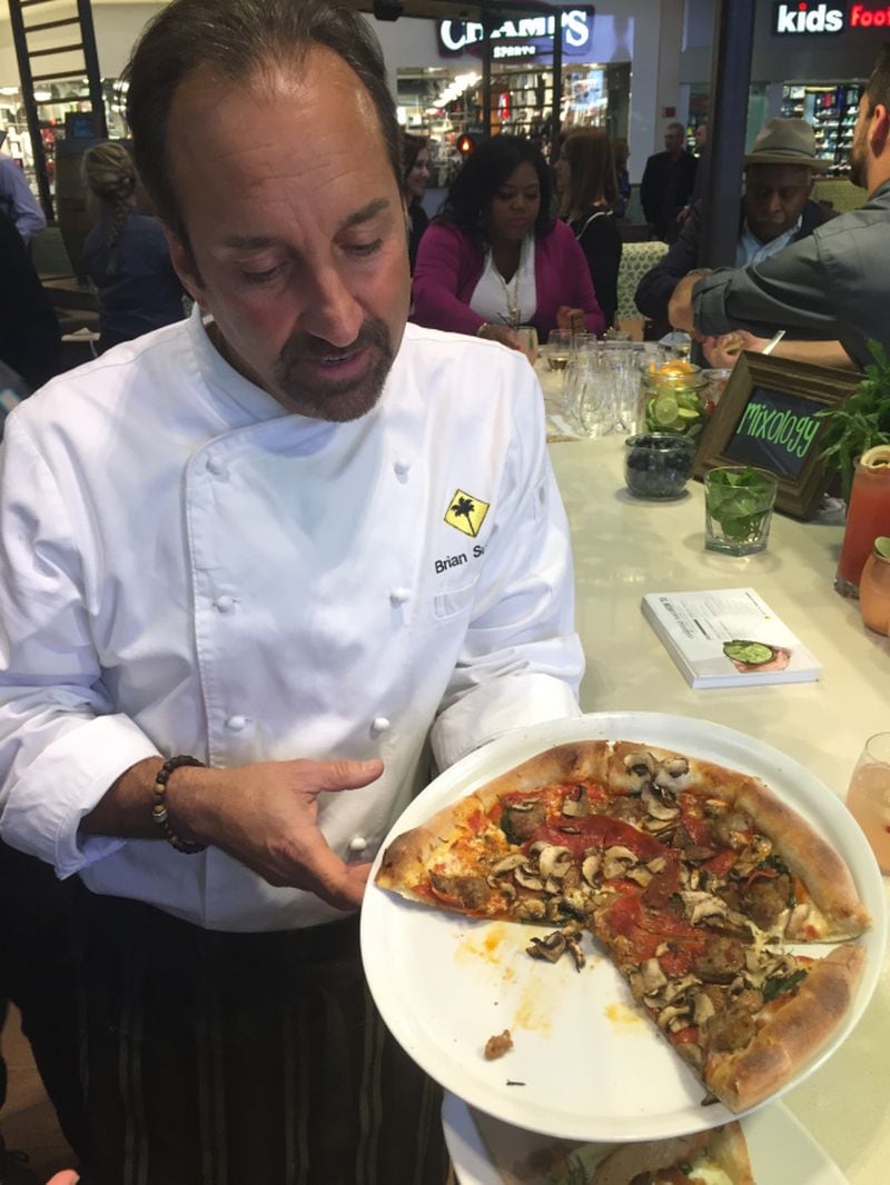 California Pizza Kitchen's executive chef Brian Sullivan demos a pizza at the chain's flagship Atlanta location in Lenox Square.