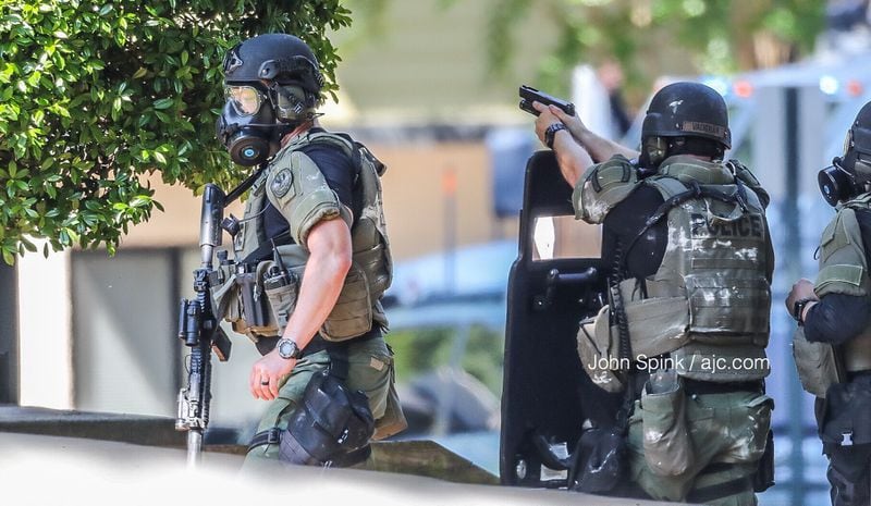 Marietta SWAT officers gathered outside The Park on Windy Hill apartment complex on Windy Hill Road.