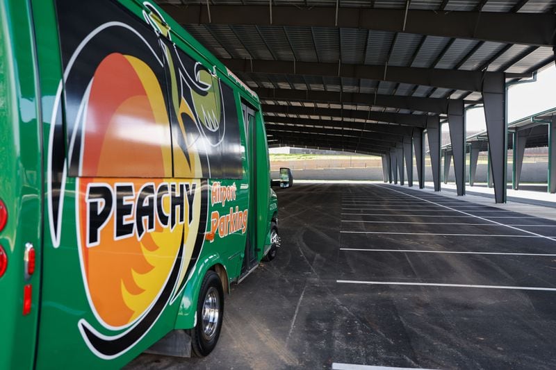 A Peachy Airport Parking vehicle shown at the site of the new covered parking facility on Wednesday, March 13, 2024. The new lot,  set to open by the end of this month,  will have more than 1,000 spaces. (Natrice Miller/ Natrice.miller@ajc.com)