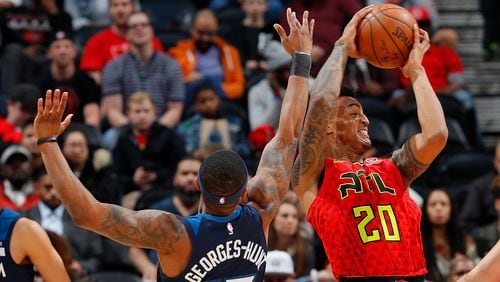 ATLANTA, GA - JANUARY 29:  Marcus Georges-Hunt #13 of the Minnesota Timberwolves attempts a steal against John Collins #20 of the Atlanta Hawks at Philips Arena on January 29, 2018 in Atlanta, Georgia.  NOTE TO USER: User expressly acknowledges and agrees that, by downloading and or using this photograph, User is consenting to the terms and conditions of the Getty Images License Agreement.  (Photo by Kevin C. Cox/Getty Images)