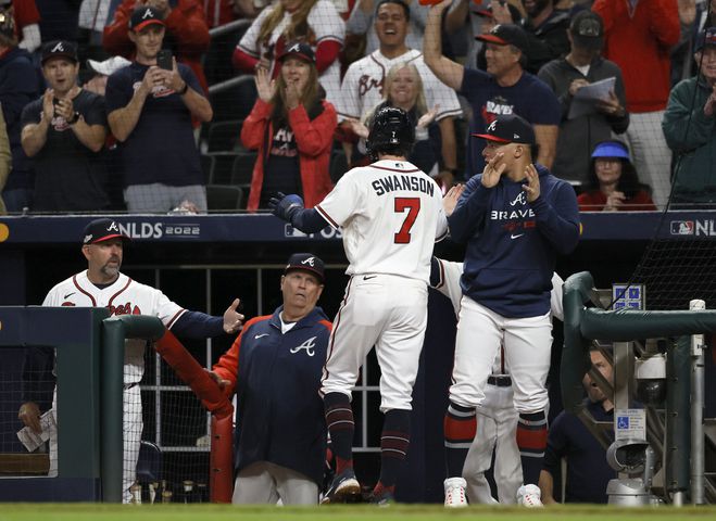 Atlanta Braves shortstop Dansby Swanson (7) celebrates after scoring against the Philadelphia Phillies on an RBI single by Austin Riley during the sixth inning of game two of the National League Division Series at Truist Park in Atlanta on Wednesday, October 12, 2022. (Jason Getz / Jason.Getz@ajc.com)