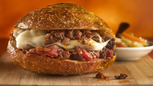A sloppy Giuseppe (the classic sloppy Joe but with Italian accents like red wine, oregano, provolone and giardiniera) goes great with red wines like a Tuscan blend, a Rhone or a Rioja.  (Bill Hogan/Chicago Tribune/TNS)