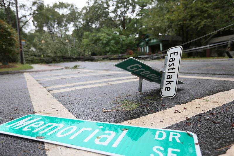 A street sign lies in the road at a DeKalb County intersection Tuesday after Irma passed through Atlanta as a tropical storm the night before.